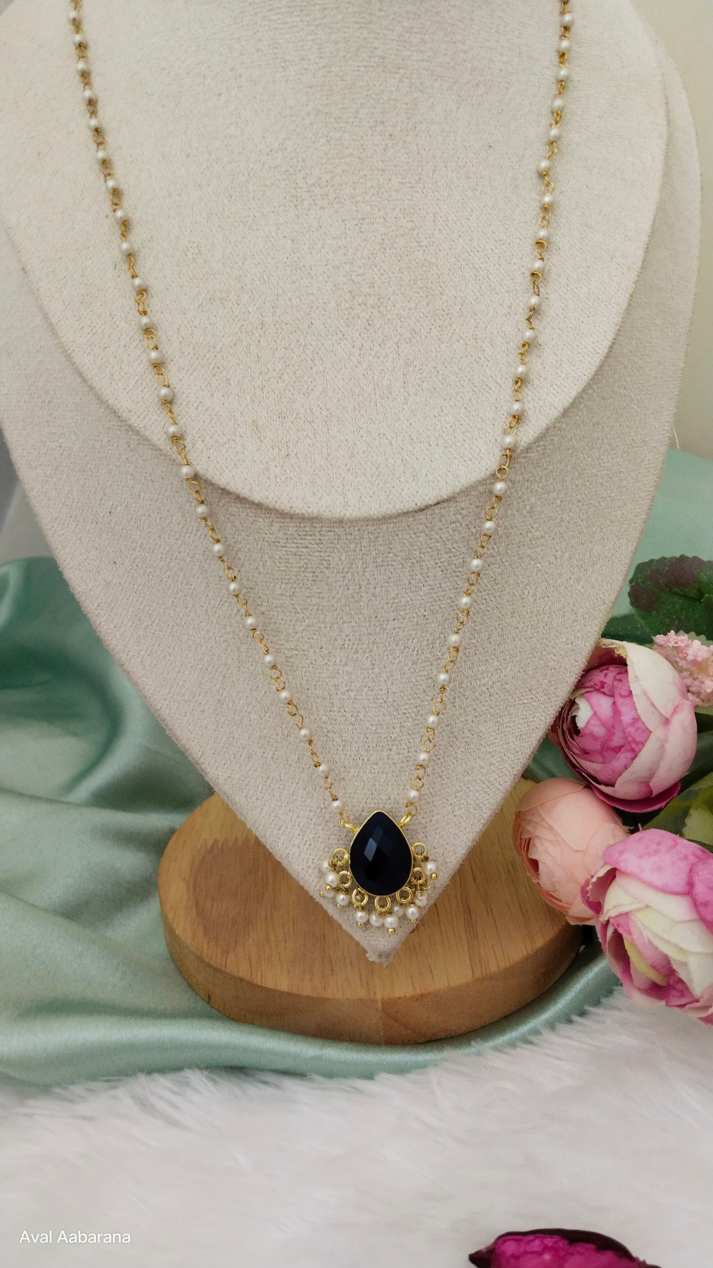 Crystal stone petal pendant adorned with pearl chain,aval aabarana ,best fashion jewellery brand, brass earrings