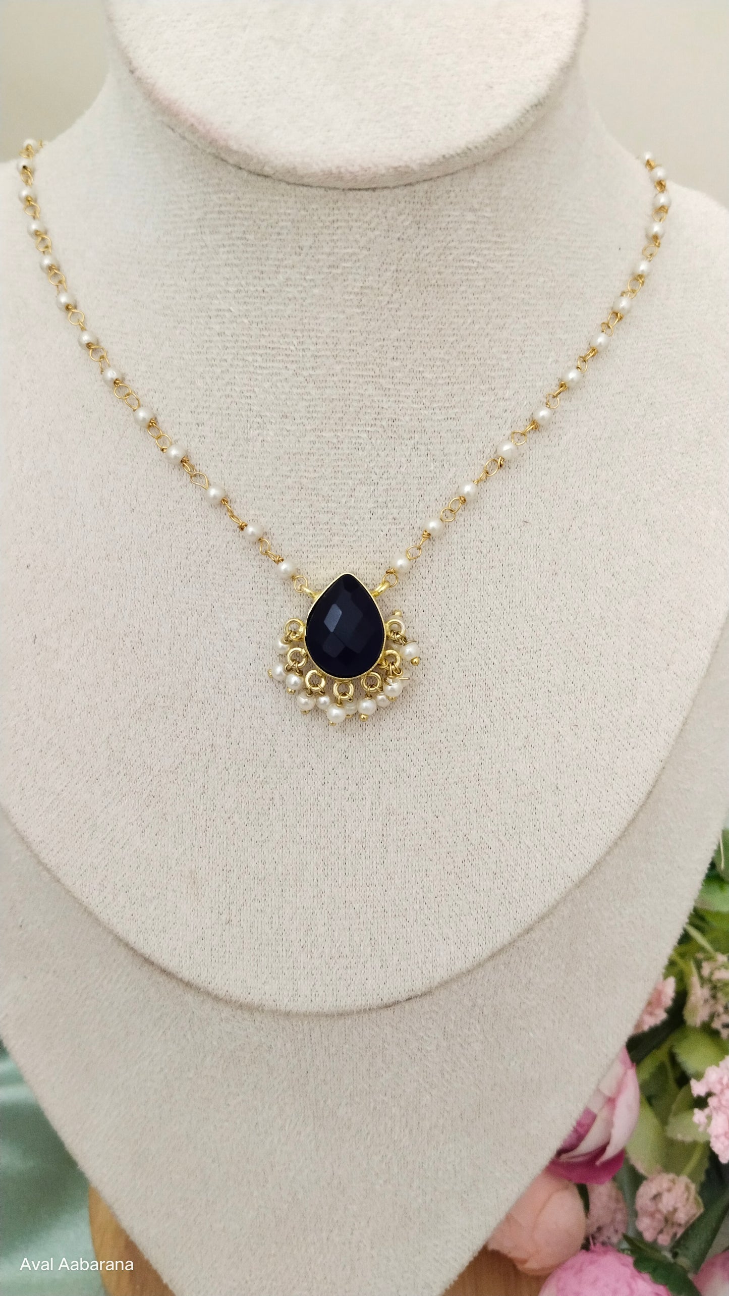 royal blue Crystal stone petal pendant adorned with pearl chain