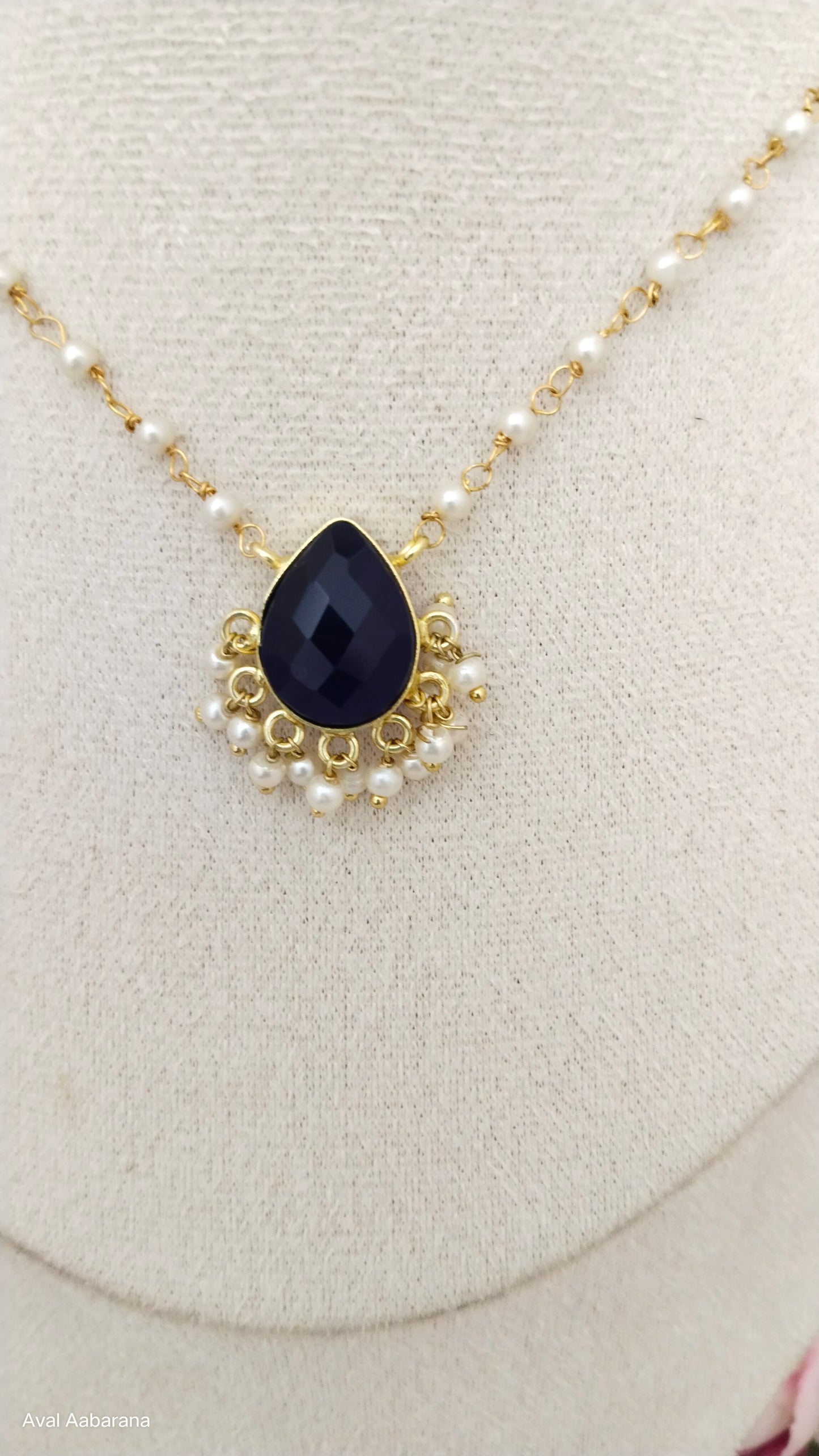 Crystal stone petal pendant adorned with pearl chain,aval aabarana ,best fashion jewellery brand, brass earrings