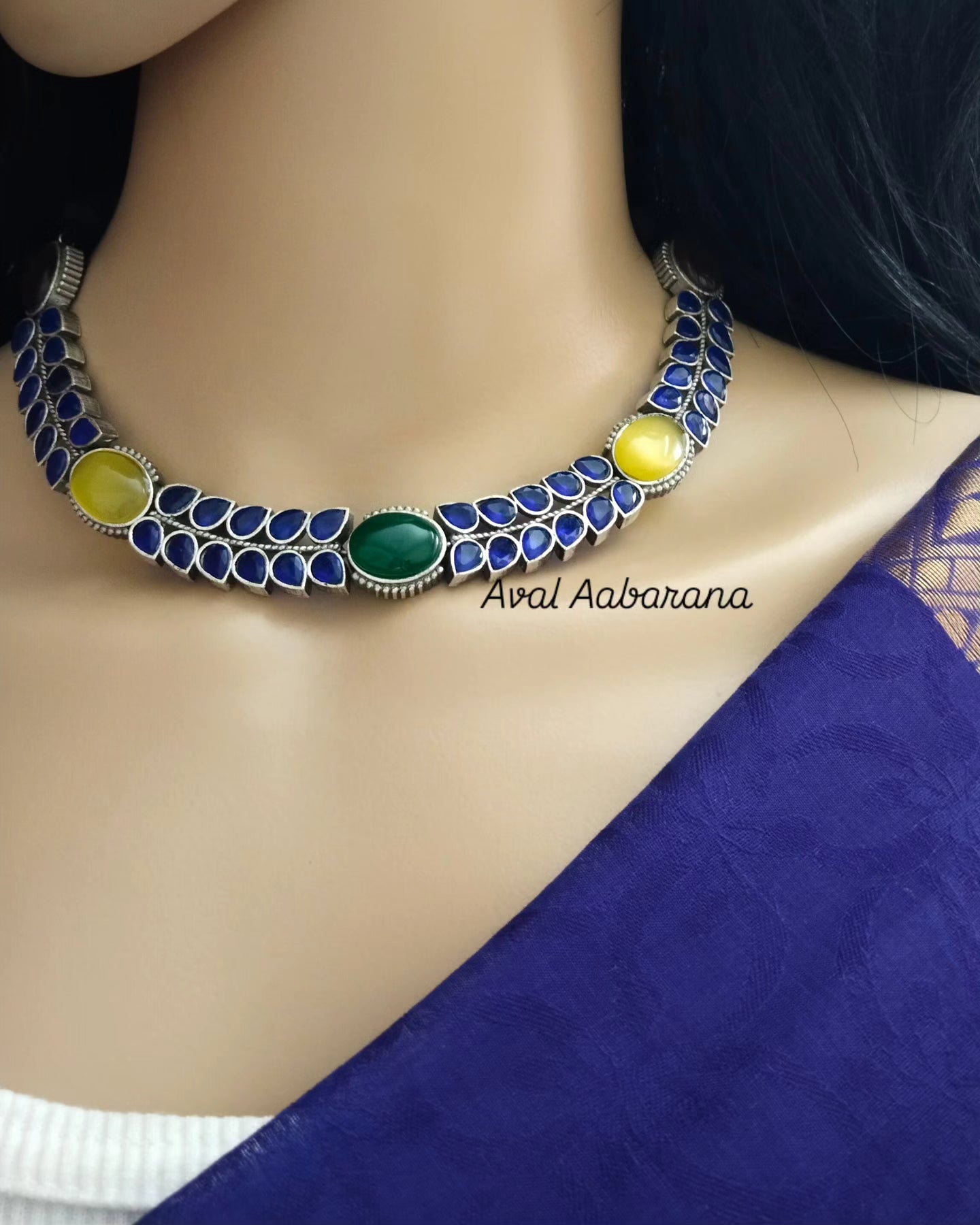 Silver replica necklace with blue stone