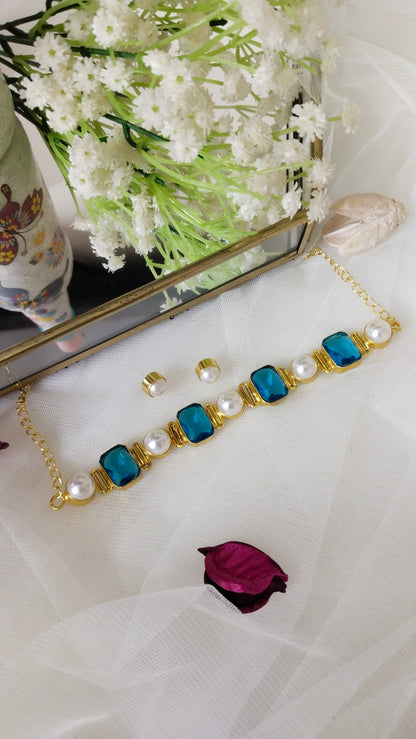Blue stone choker adorned with pearl