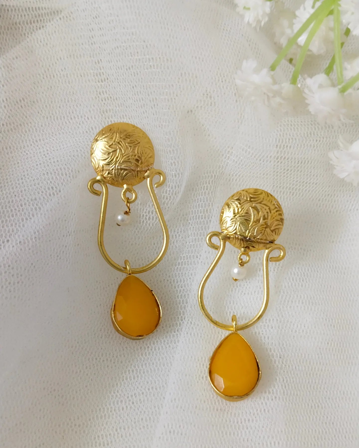 Cute brass earring with yellow stone